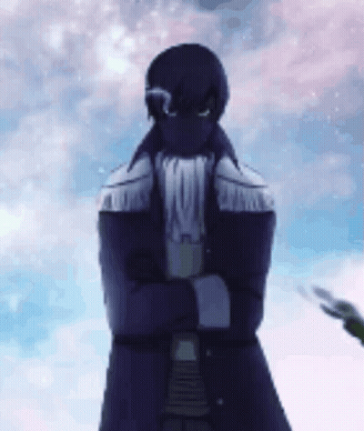 A Man In A Purple Coat Is Standing With His Arms Crossed . GIF