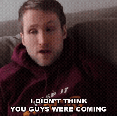 A Man In A Purple Hoodie Says " I Did N't Think You Guys Were Coming " While Sitting GIF