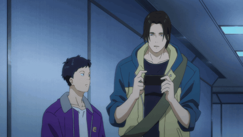 A Man In A Purple Jacket Has The Letter E On The Front GIF