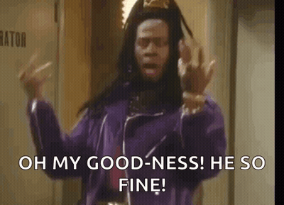 A Man In A Purple Jacket Is Standing In A Hallway And Says `` Oh My Goodness He So Fine '' GIF