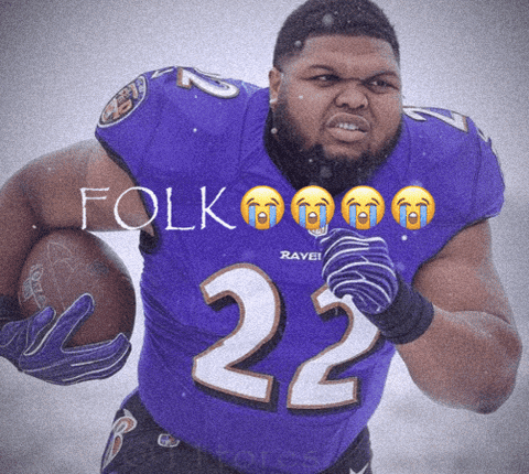 A Man In A Purple Jersey With The Number 22 Holding A Football GIF