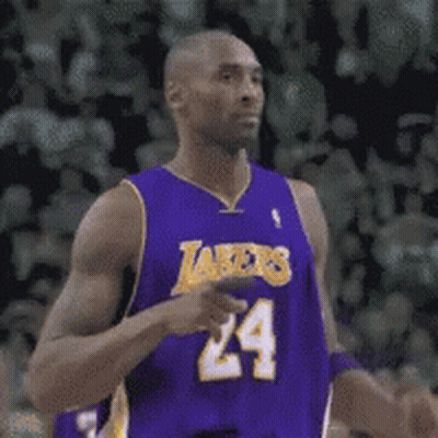 A Man In A Purple Jersey With The Number 24 On It GIF