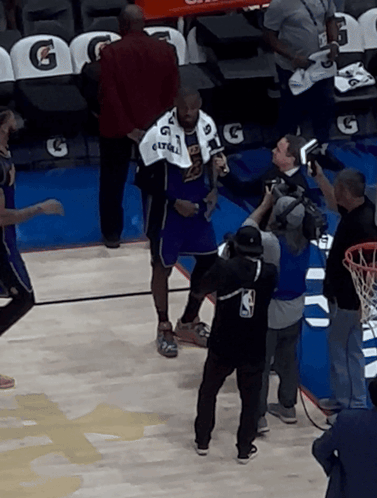 A Man In A Purple Jersey With The Number 6 On It Stands On A Basketball Court GIF