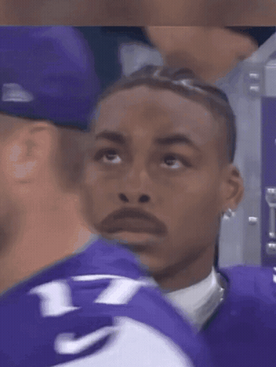 A Man In A Purple Jersey With The Number 7 On It GIF