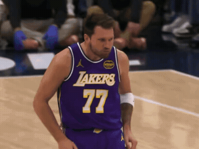 A Man In A Purple Lakers Jersey Stands On The Court GIF
