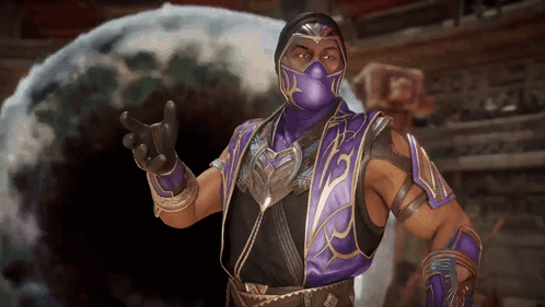 A Man In A Purple Mask And Armor Is Giving The Middle Finger GIF