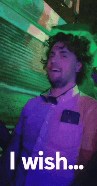 A Man In A Purple Shirt And Bow Tie Is Saying `` I Wish ... '' GIF