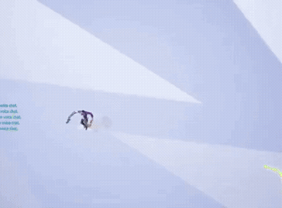 A Man In A Purple Shirt Is Flying Through The Air GIF