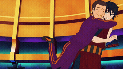 A Man In A Purple Shirt Is Hugging Another Man In A Red Shirt GIF