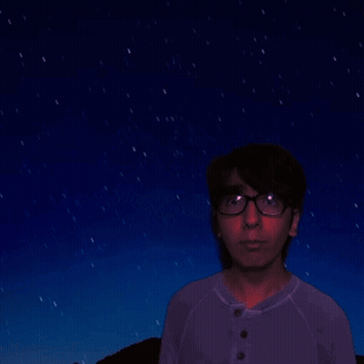 A Man In A Purple Shirt Is Looking At A Starry Night Sky GIF