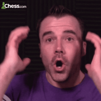 A Man In A Purple Shirt Is Making A Surprised Face With Chess.com In The Background GIF