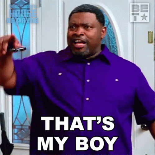 A Man In A Purple Shirt Is Saying " That 'S My Boy " GIF