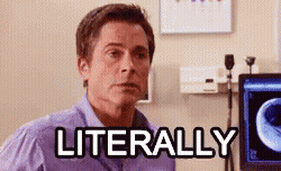 A Man In A Purple Shirt Is Sitting In Front Of A Computer With The Word Literally Written On It . GIF