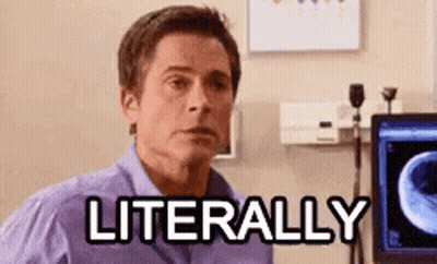 A Man In A Purple Shirt Is Sitting In Front Of A Computer With The Words `` Literally '' Written On The Screen . GIF