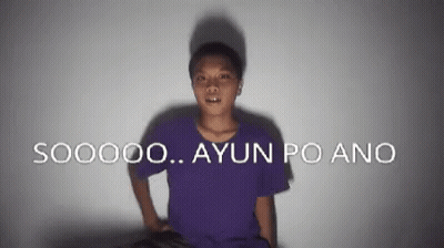 A Man In A Purple Shirt Is Standing In Front Of A Wall That Says S00000 Ayun Po Ano GIF