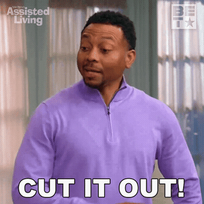 A Man In A Purple Shirt Is Standing In Front Of A Window And Says `` Cut It Out '' . GIF