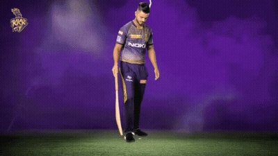 A Man In A Purple Shirt That Says Noki On It GIF