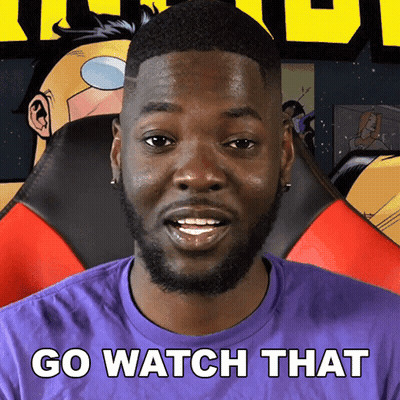 A Man In A Purple Shirt With The Words Go Watch That Written On It GIF
