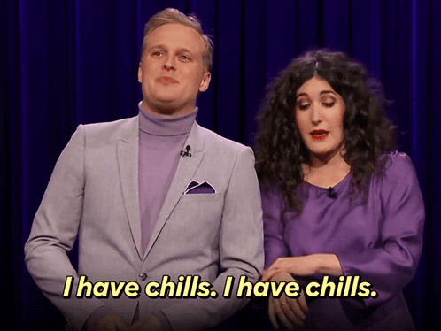 A Man In A Purple Suit And A Woman In A Purple Dress Say I Have Chills GIF