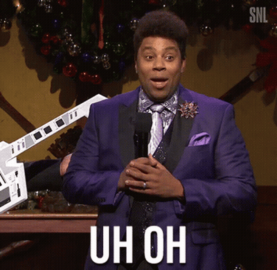 A Man In A Purple Suit And Tie Is Holding A Microphone And Says Uh Oh GIF