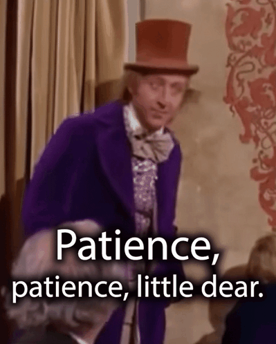 A Man In A Purple Suit And Top Hat Says Patience , Patience Little Dear . GIF