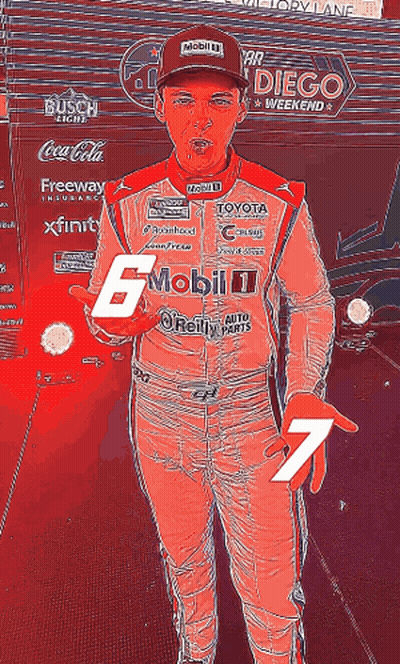 A Man In A Racing Suit Has The Number 7 On His Hand GIF