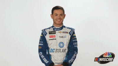 A Man In A Racing Suit With Dc Solar On It GIF