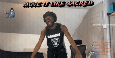 A Man In A Raiders Jersey Is Dancing In Front Of A Screen That Says Move It Like Sacred GIF