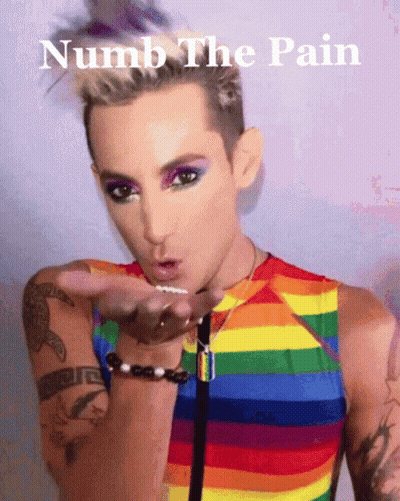 A Man In A Rainbow Shirt Blowing A Kiss With The Words Numb The Pain Below Him GIF