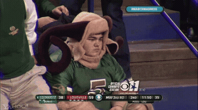 A Man In A Ram Costume Sits In The Bleachers At A Game GIF