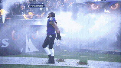 A Man In A Ravens Uniform Is Walking On A Field GIF