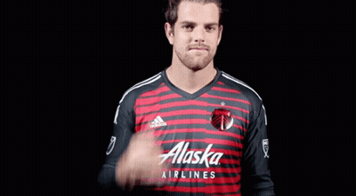 A Man In A Red And Black Alaska Airlines Shirt GIF