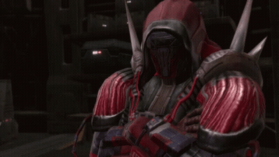 A Man In A Red And Black Armor With A Hood On His Head GIF