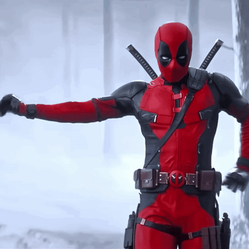 A Man In A Red And Black Deadpool Costume GIF