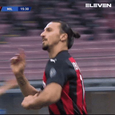 A Man In A Red And Black Jersey With The Number 18 On The Back GIF