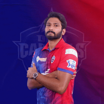 A Man In A Red And Blue Shirt With The Word Ipl On His Arm GIF