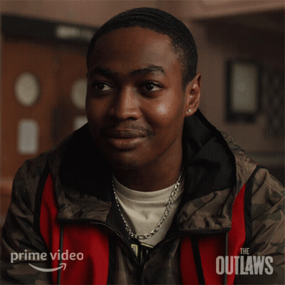 A Man In A Red And Brown Jacket With The Word Outlaws On It GIF