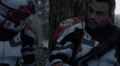 A Man In A Red And White Armor With The Number 11 On His Chest GIF