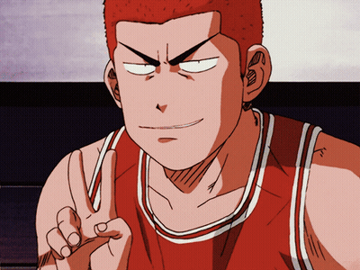 A Man In A Red And White Basketball Jersey Giving A Peace Sign GIF