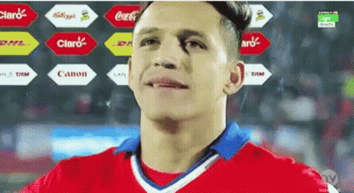 A Man In A Red And White Jersey With A Coca Cola Logo In The Background GIF