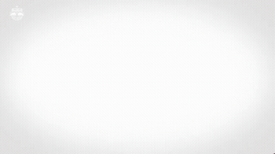 A Man In A Red And White Red Bull Jersey GIF