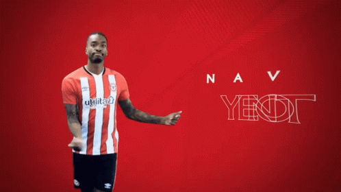 A Man In A Red And White Striped Shirt Is Standing In Front Of A Red Background That Says Ivan Toney GIF