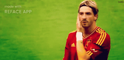 A Man In A Red And Yellow Adidas Jersey Holds His Hand To His Forehead GIF