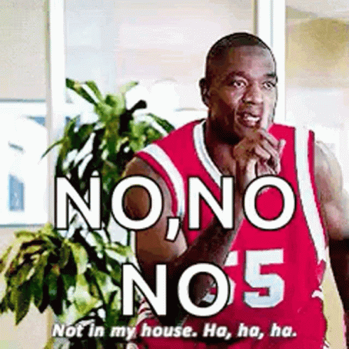 A Man In A Red Basketball Jersey Is Standing In Front Of A Plant And Says `` No , No , No 5 '' . GIF