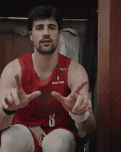 A Man In A Red Basketball Jersey With The Number 8 On It GIF