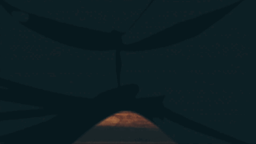 A Man In A Red Cape Is Carrying A Large Rock GIF