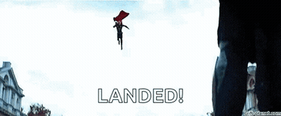 A Man In A Red Cape Is Flying Through The Air With The Words Landed Written Below Him . GIF