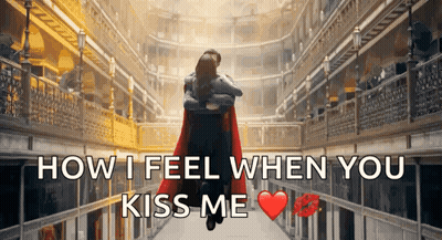 A Man In A Red Cape Is Hugging A Woman In A Hallway With The Words " How I Feel When You Kiss Me " GIF