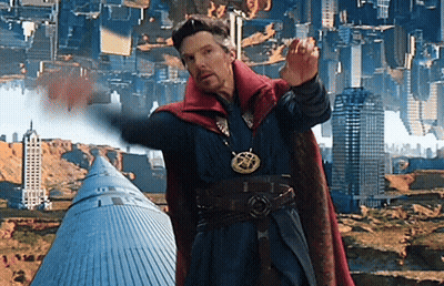 A Man In A Red Cape Is Standing In Front Of A City With Buildings Upside Down GIF