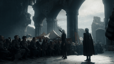 A Man In A Red Cape Stands In Front Of A Crowd GIF
